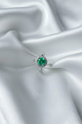 Oval green gemstone ring